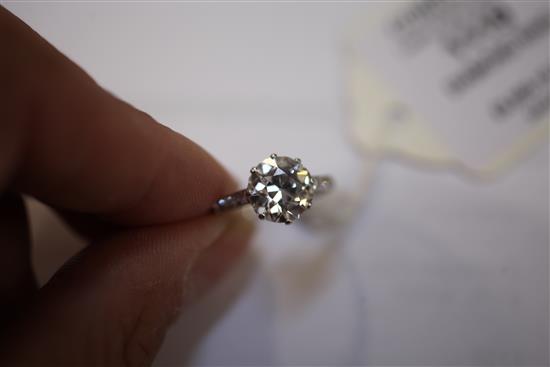 A 1940s/1950s platinum and single stone diamond ring with diamond set shoulders, size L.